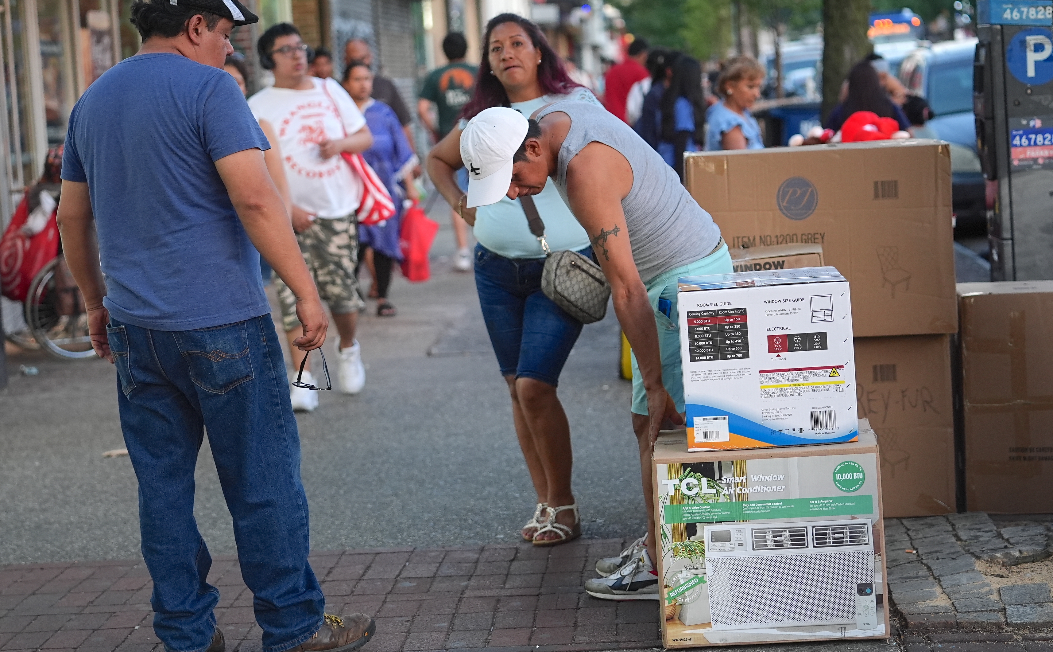 Some residents meet their air conditioning needs on a day of record-breaking heat