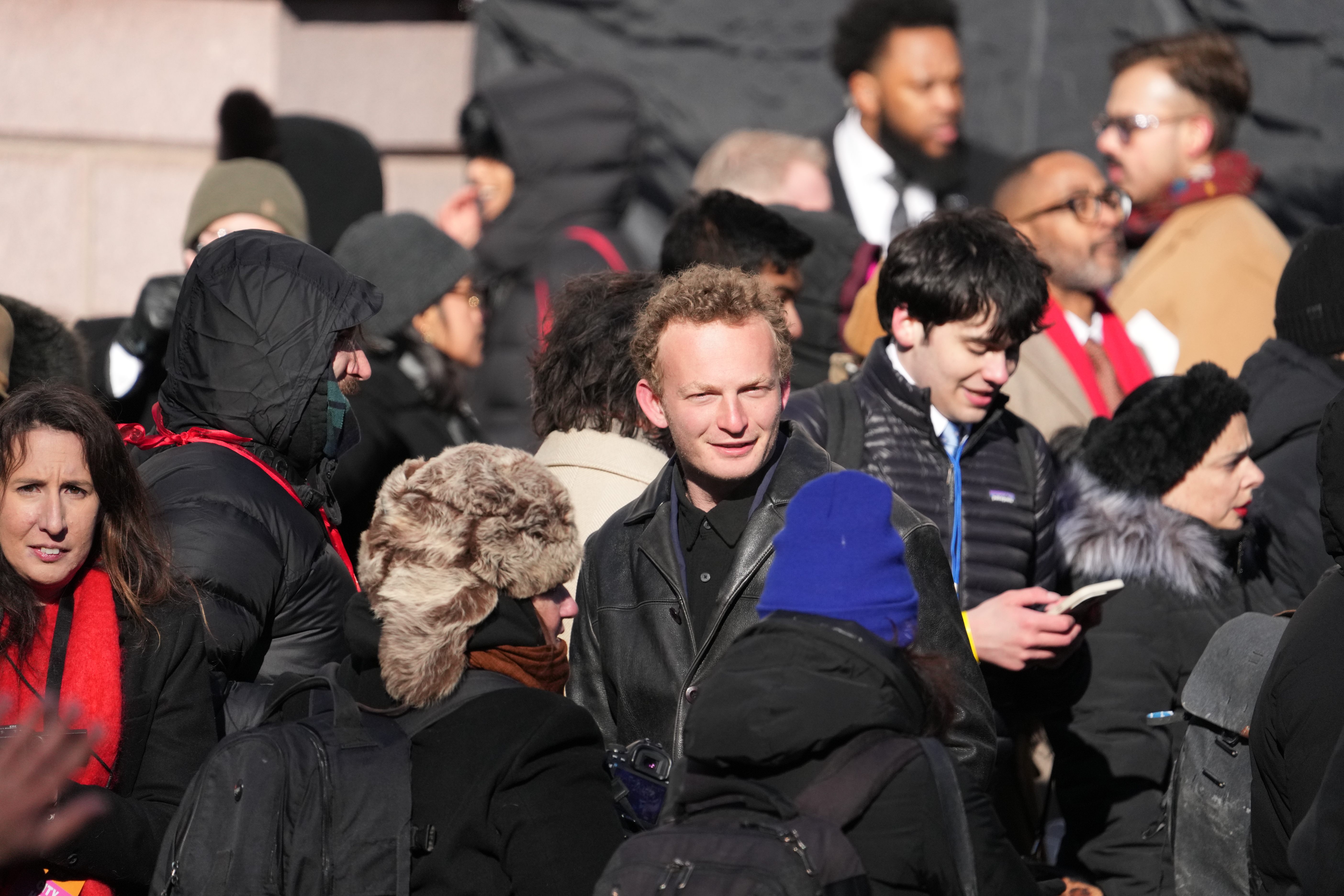 A blond man in a crowd.