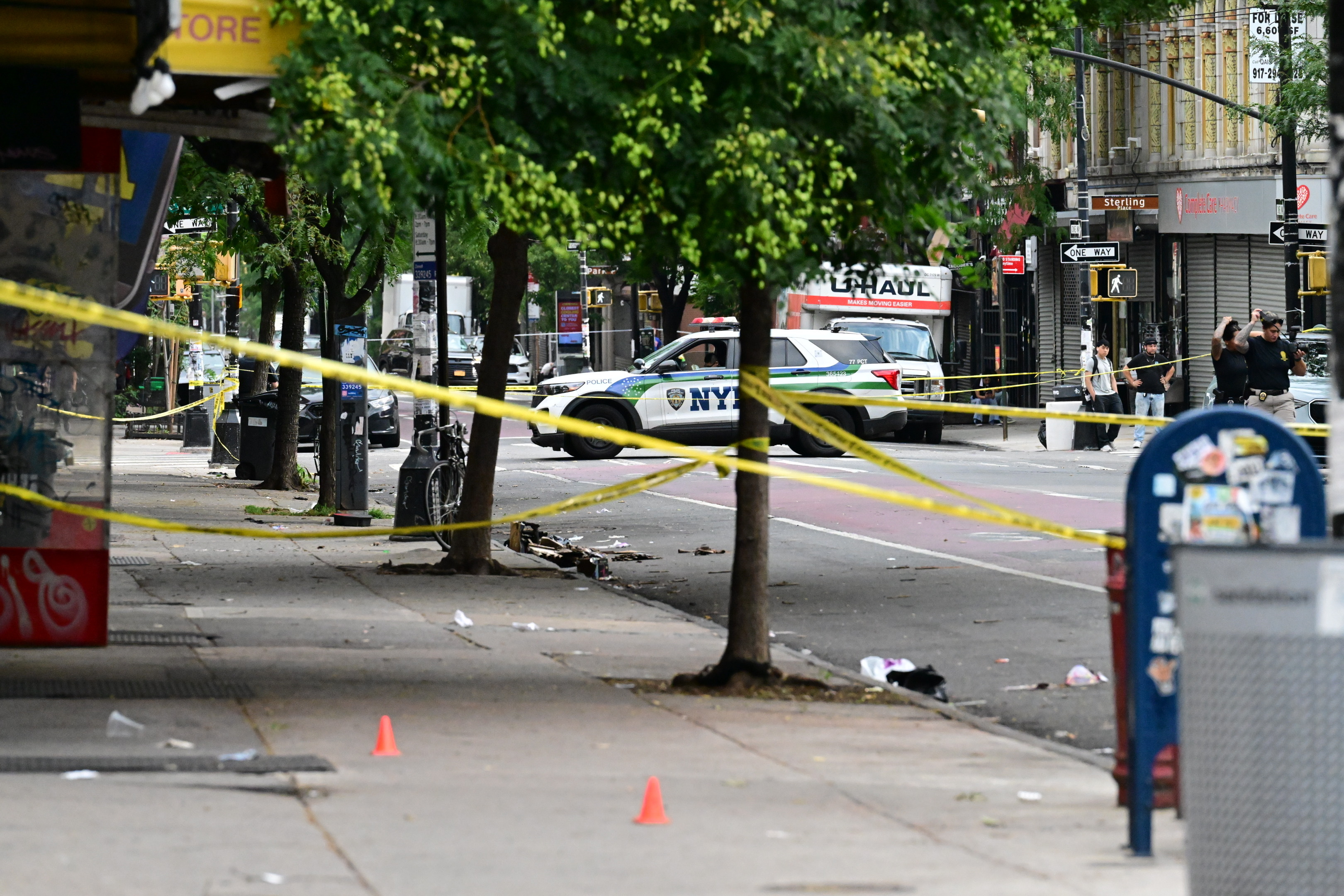Members of the NYPD crime scene unit process the scene where an NYPD officer was shot in the vest in the area of Nostrand Avenue and St. Johnâs Place in Brooklyn, New York, United States on July 5, 2026.