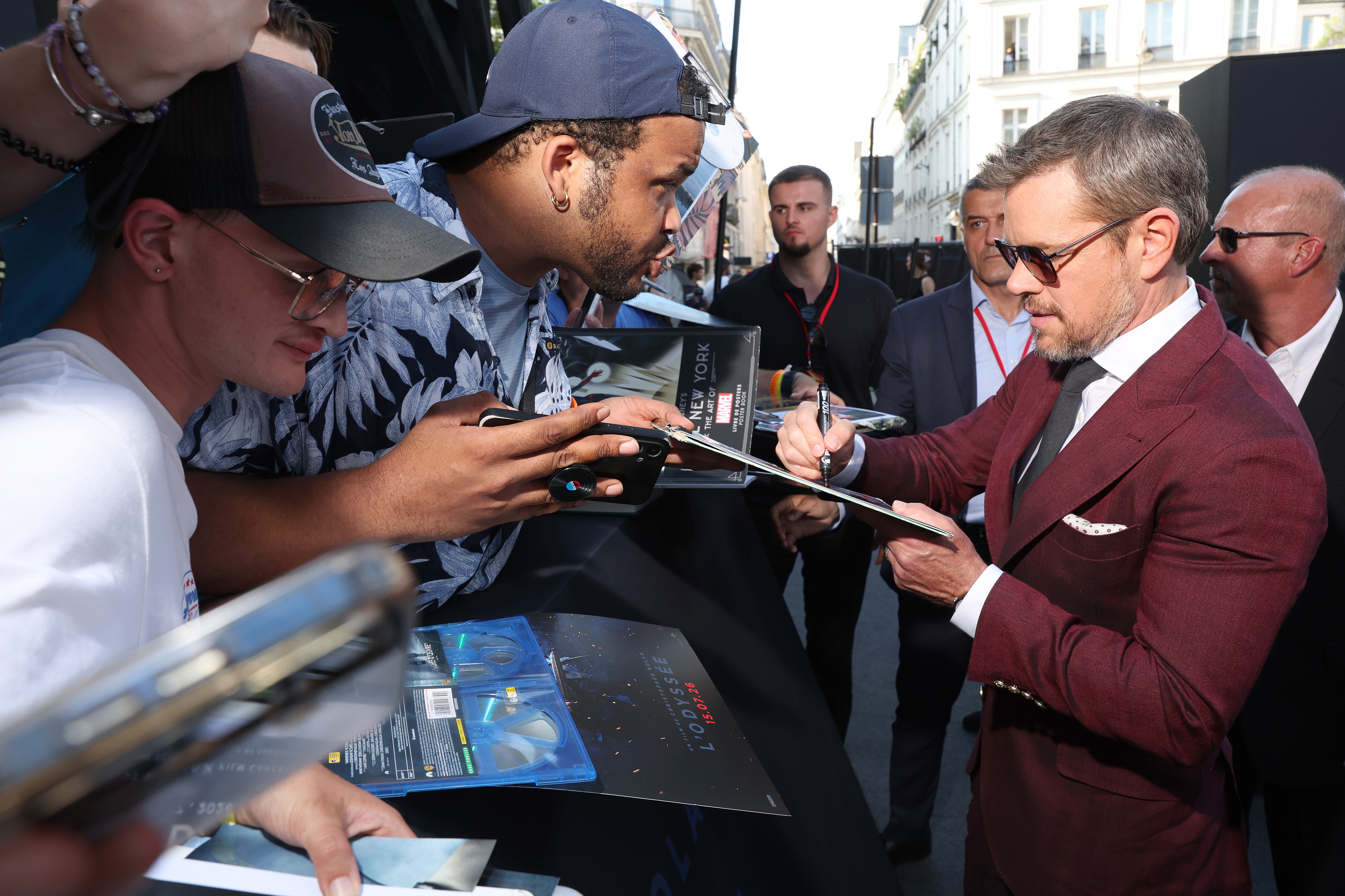 Fans ask Matt Damon for autographs at the New York premeire of "The Odyssey."