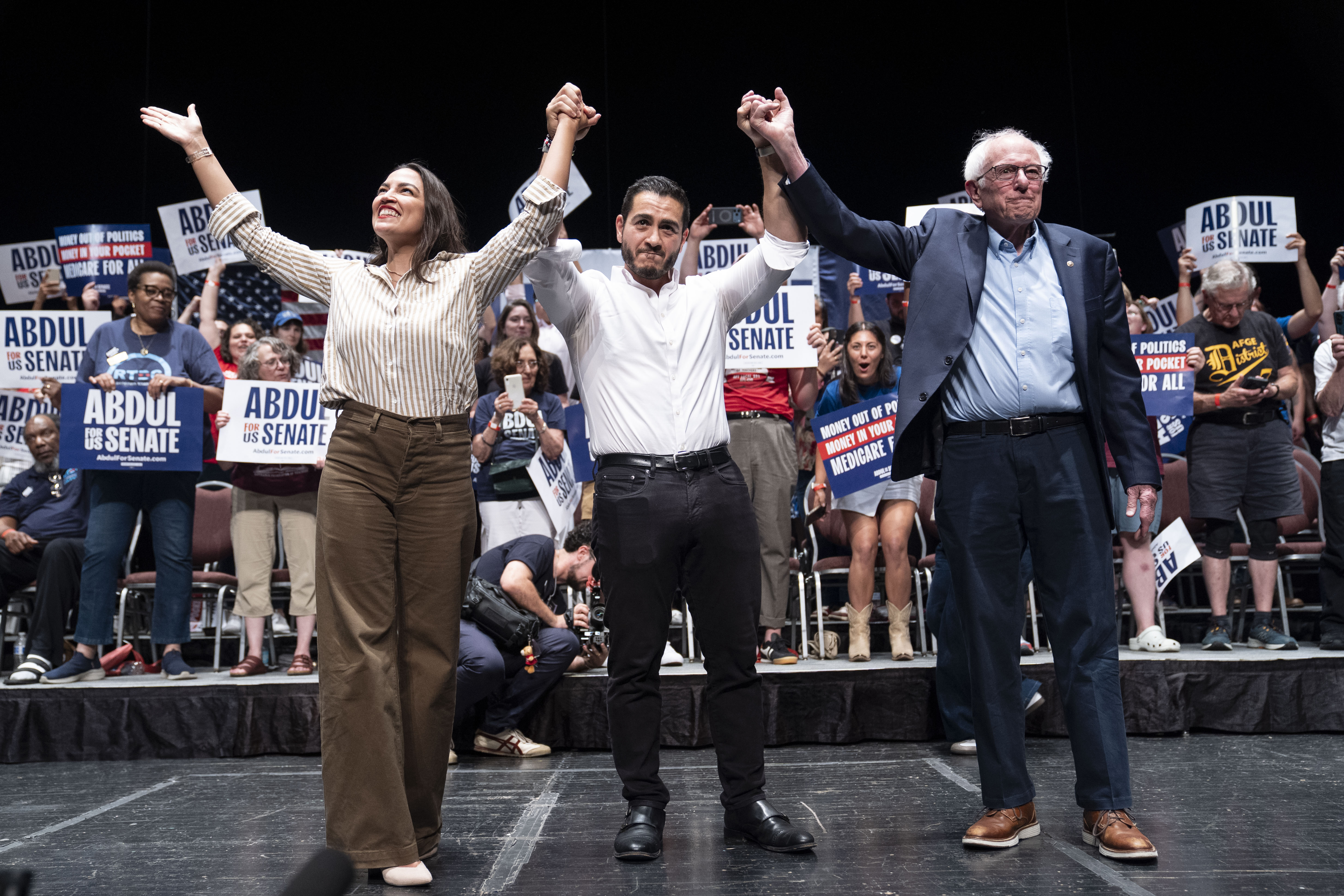 AOC, Abdul El-Sayed and Bernie Sanders at a rally.