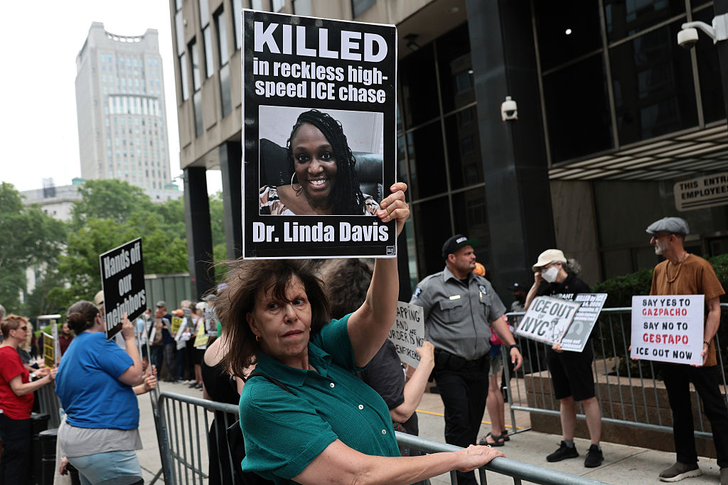 Immigrant rights activist hold signs as they protest Immigration and Customs Enforcement outside of the Jacob K. Javits Federal Building on July 16, 2026, in New York City.  A Republican-controlled House committee is looking into the funding and activities of a New York City-based group that has helped organize such protests against Trump administration policies.