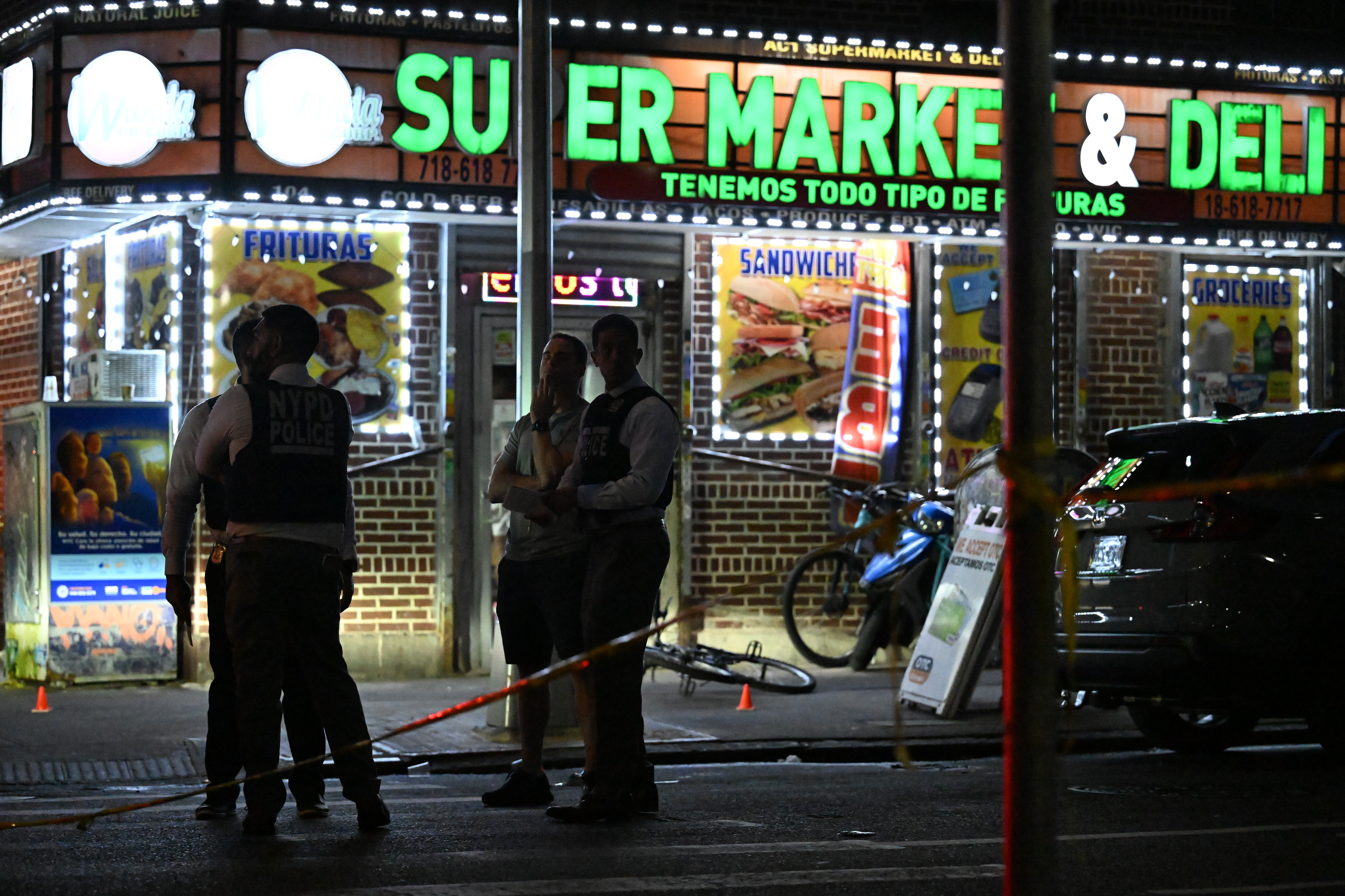 Photo of NYPD officers at scene of shooting outside a bodega in The Bronx
