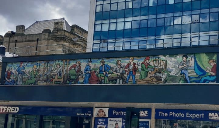 A mural from Huddersfield showing the past jobs of local people.