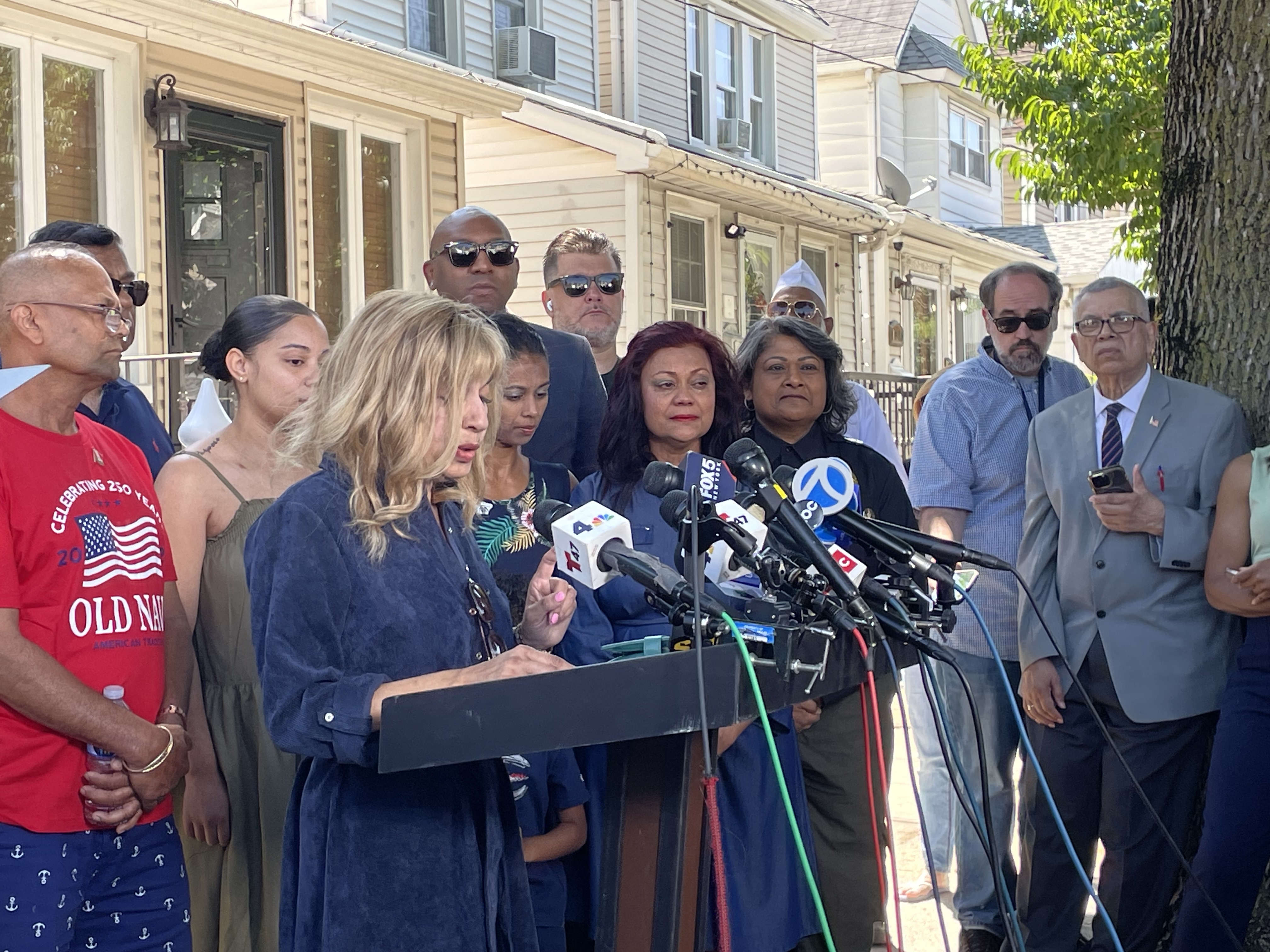Sgt. Angel S. Rampersad's aunt, Judy Rackal, speaks while Rampersad's mother, Carol Acevedo looks on.