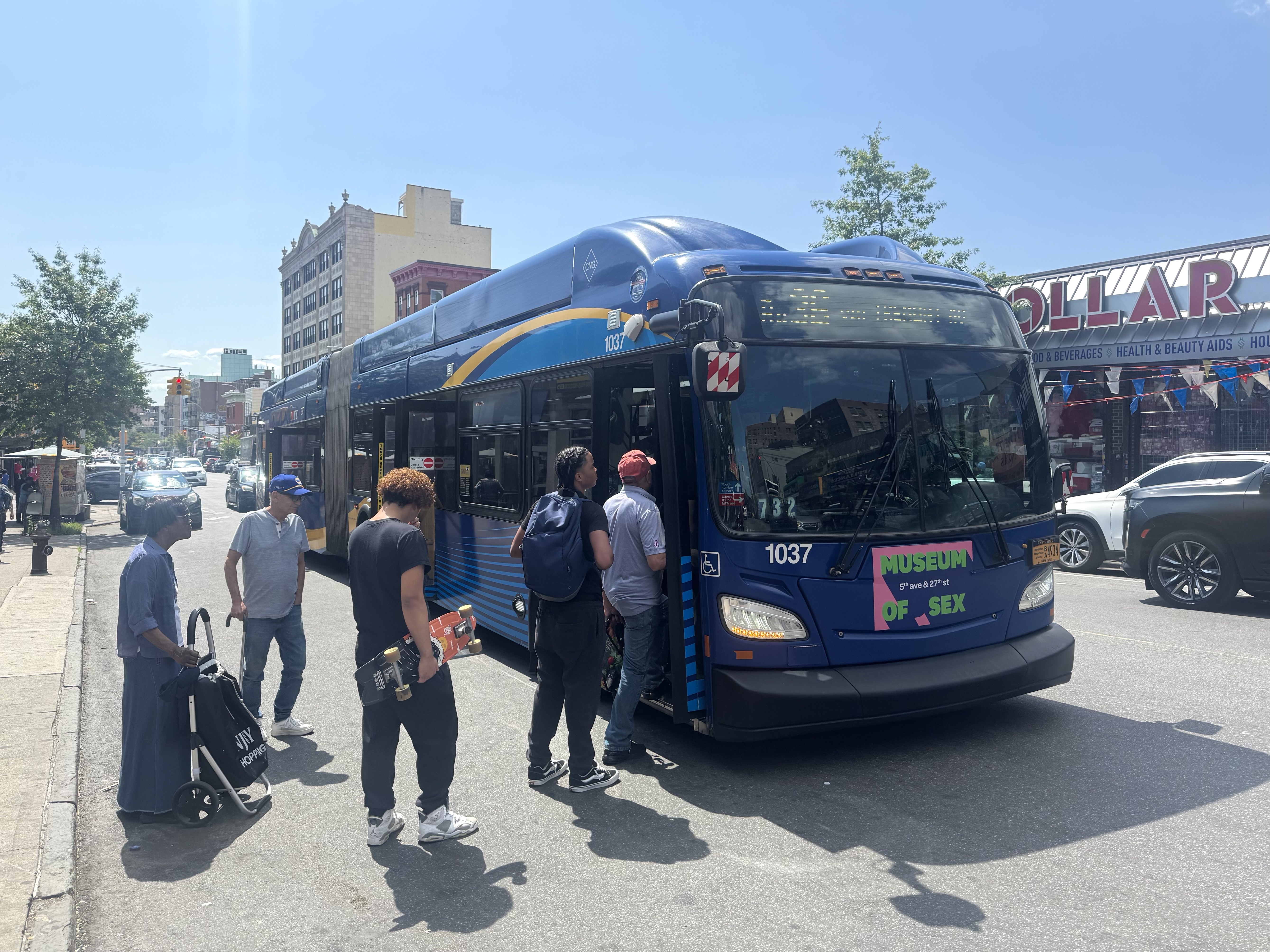 Bus riders get on a Bx36 bus on Tremont Avenue.