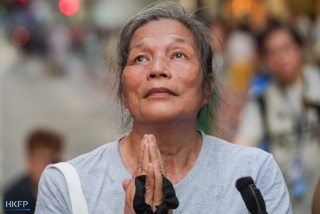 Hong Kong activist Lui Yuk-lin walks and chants a Buddhist mantra in Causeway Bay on June 4, 2026. Photo: Kyle Lam/HKFP.