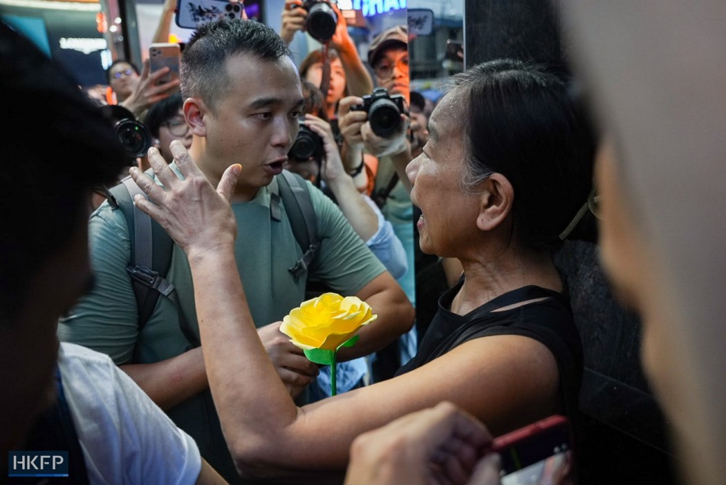 Activist Chan Po-ying appears in Causeway Bay with a yellow paper flower on June 4, 2026. Photo: Kyle Lam/HKFP.