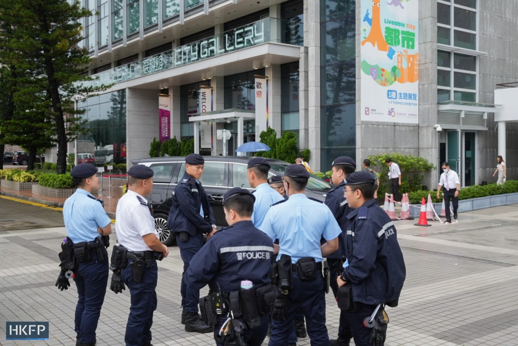 Police officers outside City Gallery, where the investigative hearings are taking place, on July 15, 2026. Photo: Kyle Lam/HKFP.
