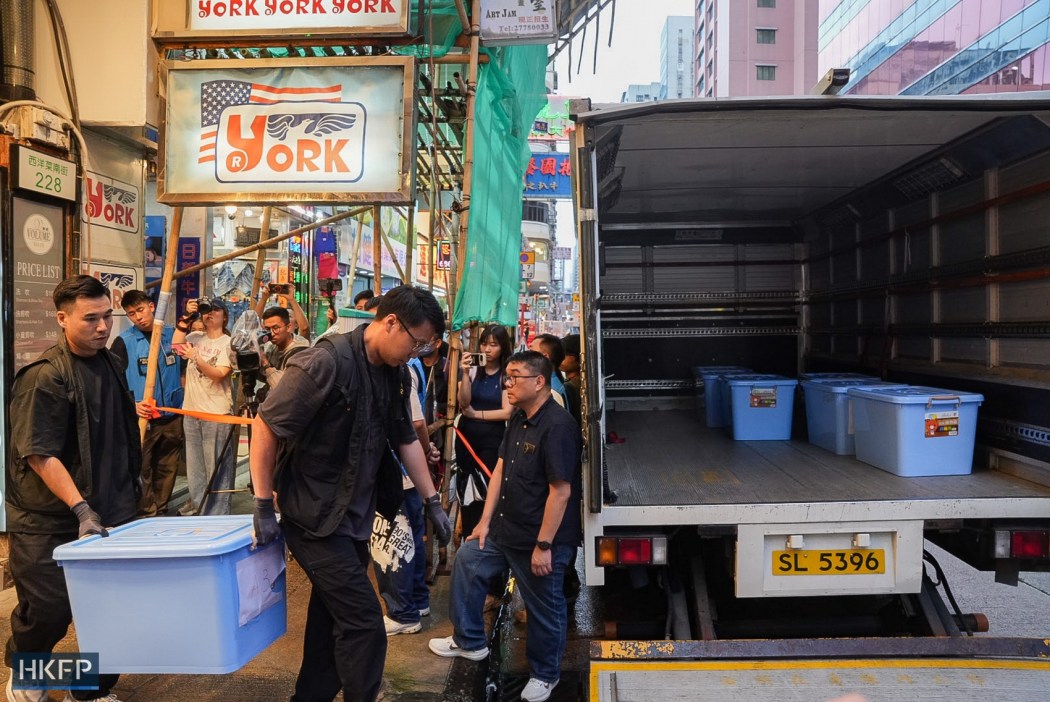 Police loaded materials understood to have been taken from the bookstore onto a truck. Photo: Kyle Lam/HKFP.