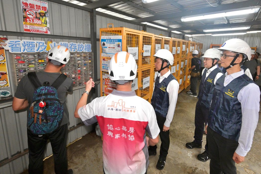 Commissioner for Labour Sam Hui (third from right) inspects a construction site in To Kwa Wan on July 17, 2026, as a smoking ban on construction sites take effect. Photo: GovHK.