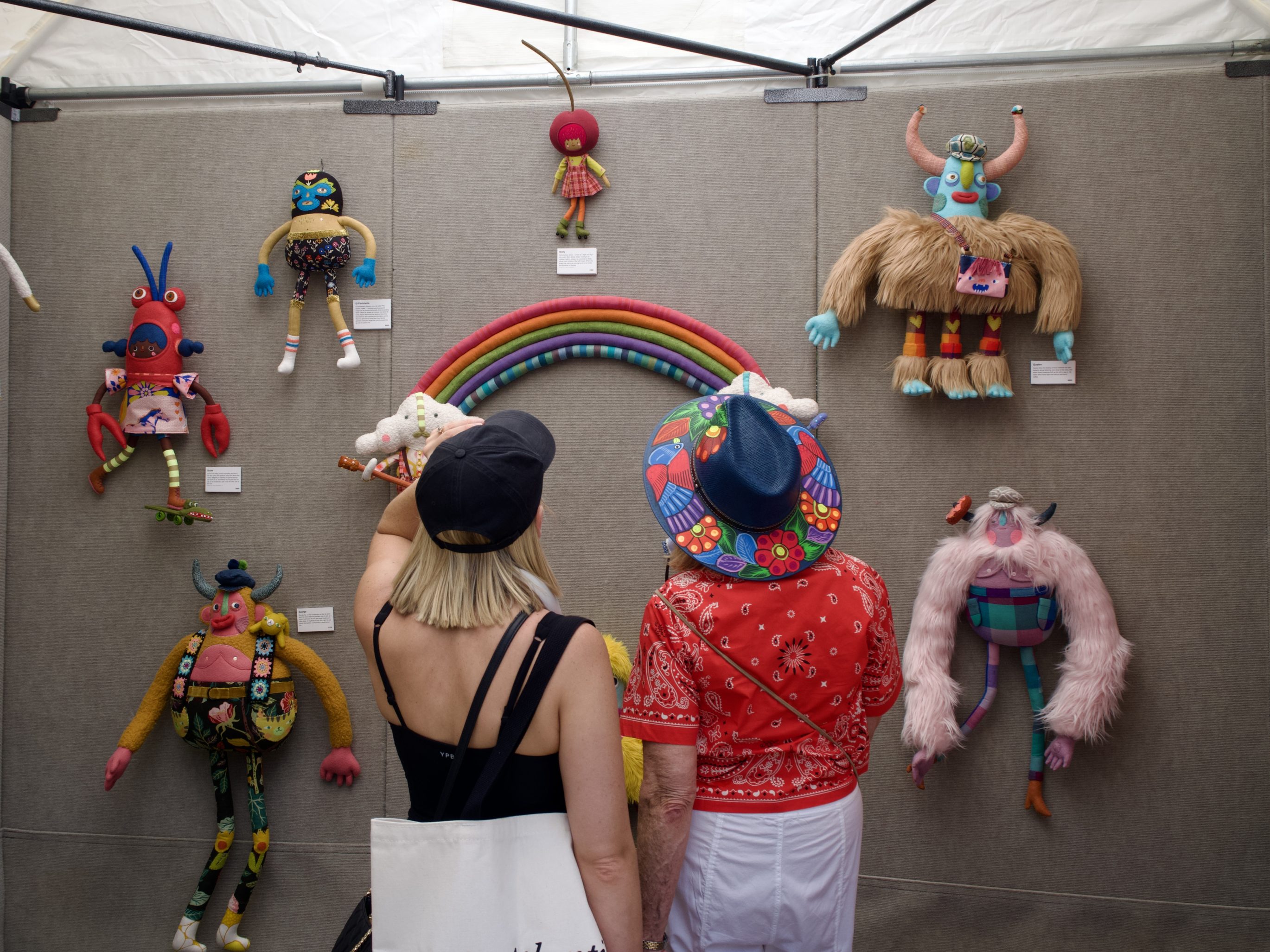 People look at art at the Cherry Creek Arts Festival