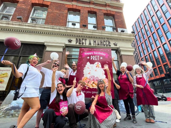Campaigners outside Pret with a giant birthday card