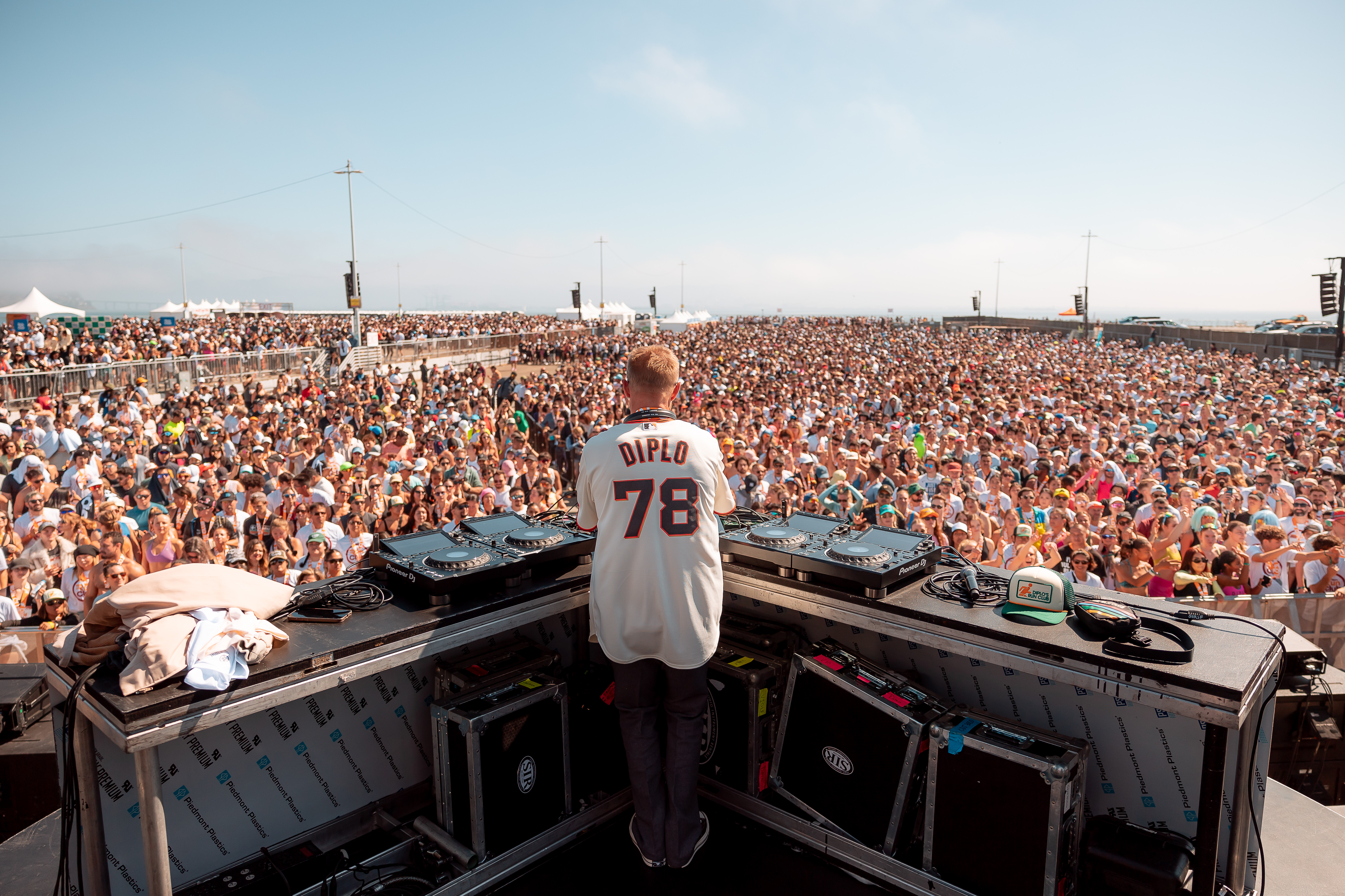 Man DJs for a large crowd.