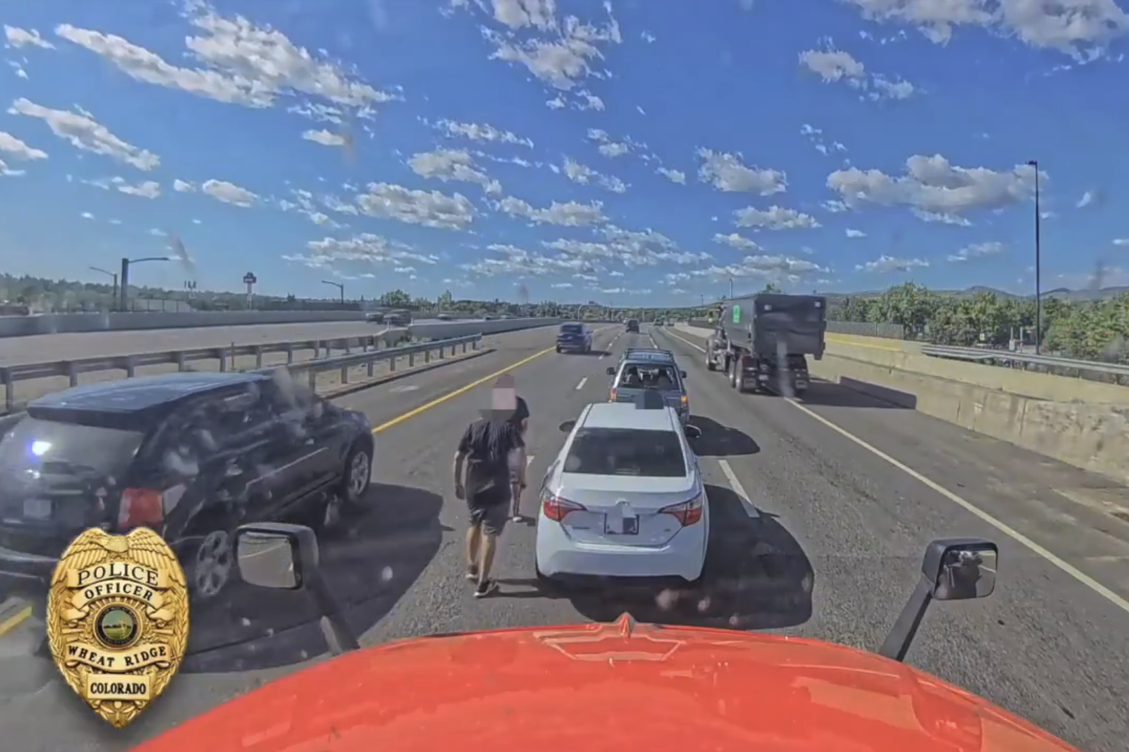 Two drivers get out of their vehicles to fight on Interstate 70 during a road rage incident on June 10, 2026.