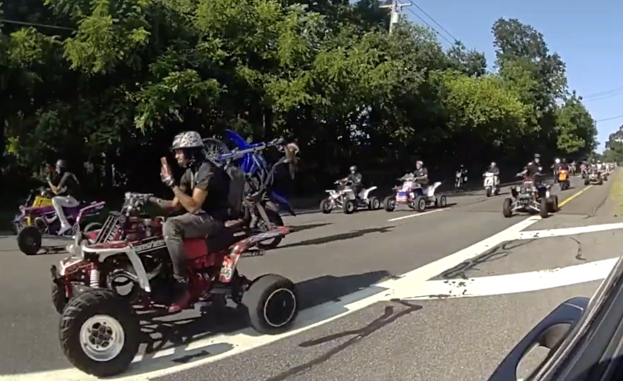 Police body camera footage shows riders taking part in an alleged street takeover in Suffolk County on Saturday.