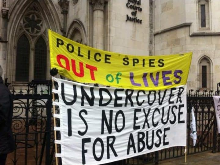 Spycops campaign banners outside Royal Courts of Justice during the Undercover Policing Inquiry