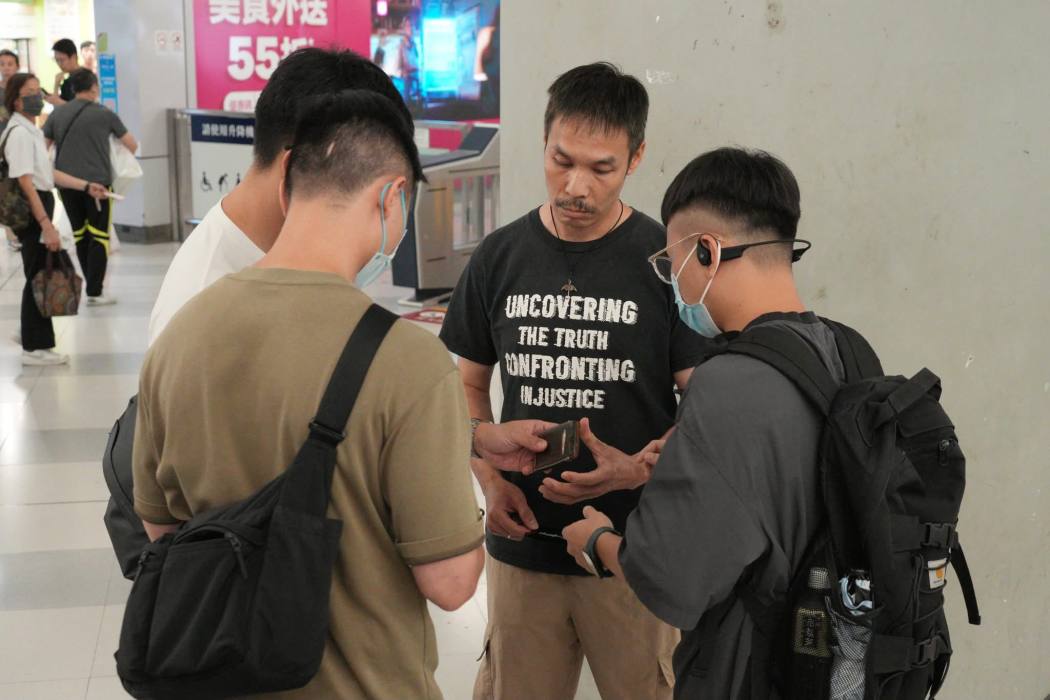 Plainclothes officers conduct a search at Yuen Long MTR station on July 21, 2026. Photo: Supplied.