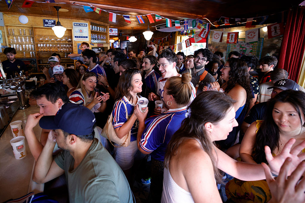 people watching a World Cup match at a bar in Brooklyn