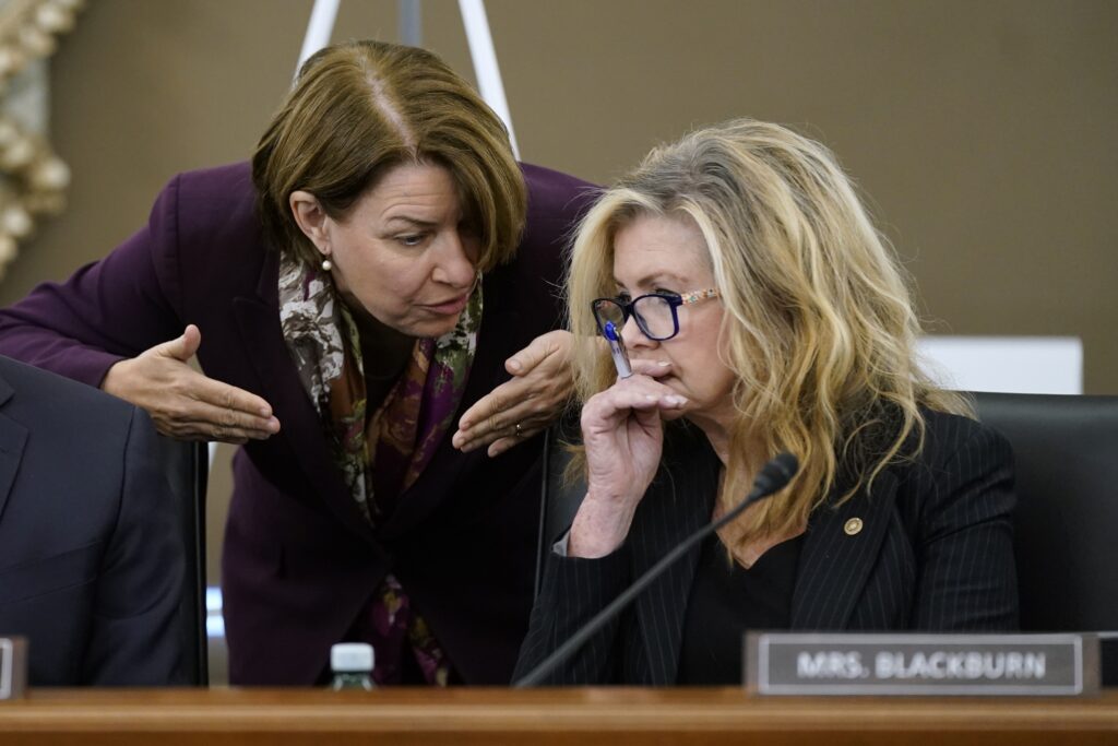 U.S. Sens. Amy Klobuchar, D-Minn., left, and Marsha Blackburn, R-Tenn., are among the record number of women running for governor this year. In this photo, they speak during a Senate subcommittee hearing on Capitol Hill on Sept. 30, 2021 in Washington, DC. (Photo by Patrick Semansky-Pool/Getty Images)Β