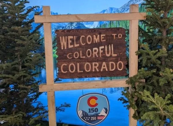 colorful colorado and 150th birthday signs at Great American State Fair