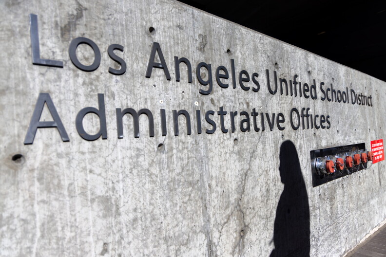 A gray concrete sign reads Los Angeles Unified School District Administrative Offices in dark grey metal letters.