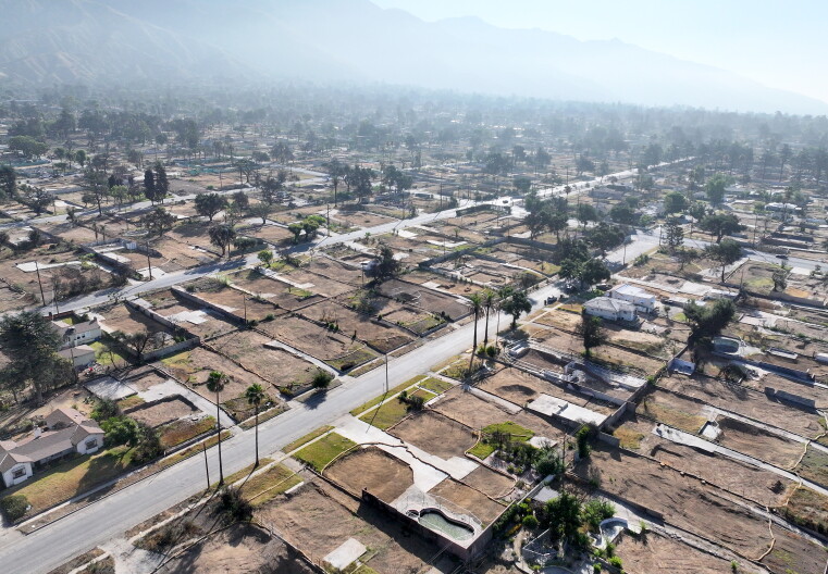 Overview shows neighborhood burned by fire with many empty lots