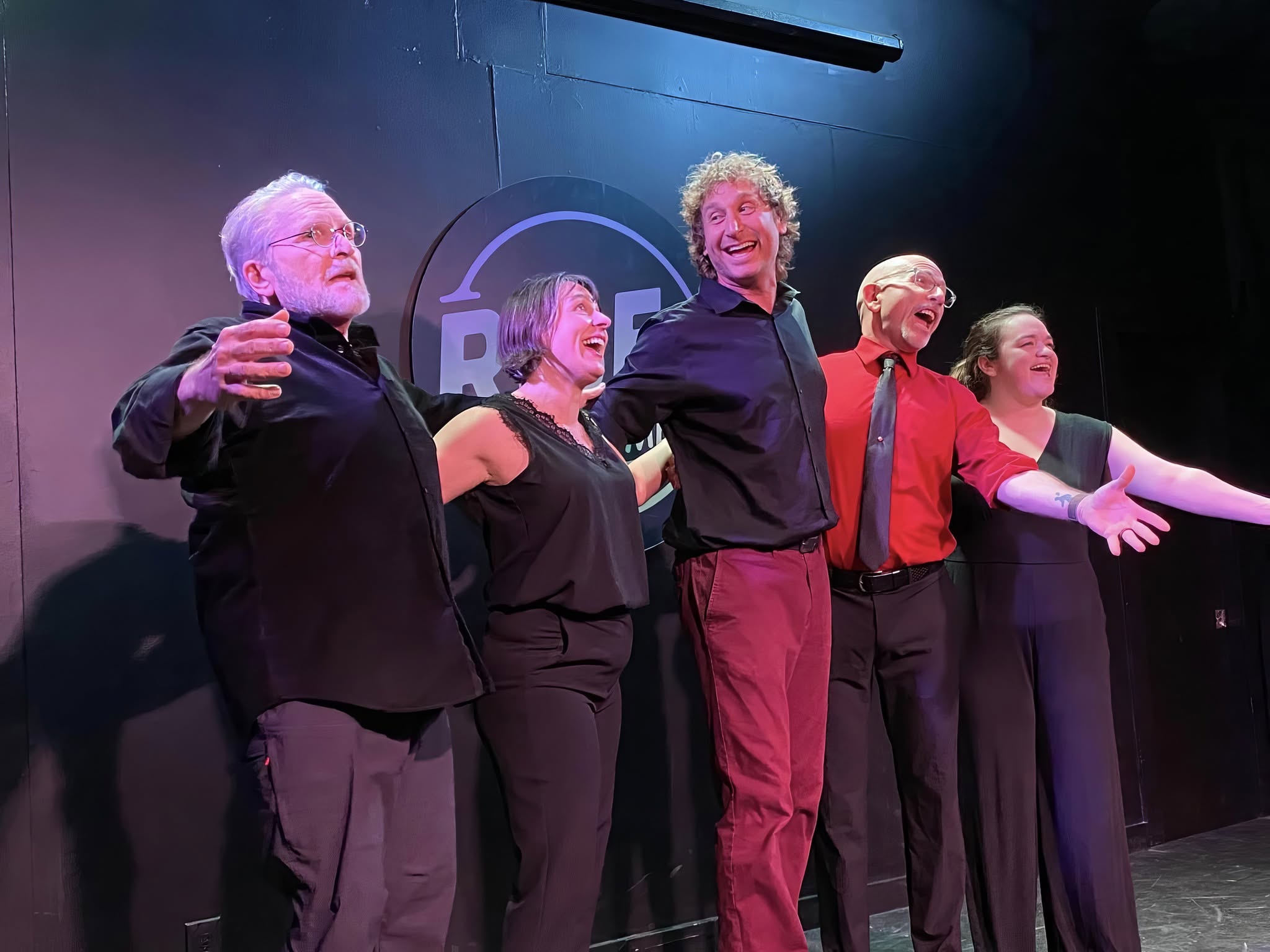 Performers sing onstage