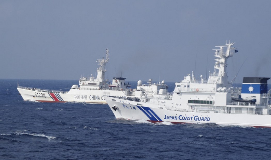 An undated photo shows a Japan Coast Guard vesel, and a China Coast Guard ship. File photo: Japan Coast Guard.