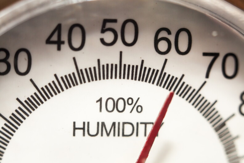 A gauge to measure humidity shows a dial marked with temperatures with a "100% Humidity" written in the center.