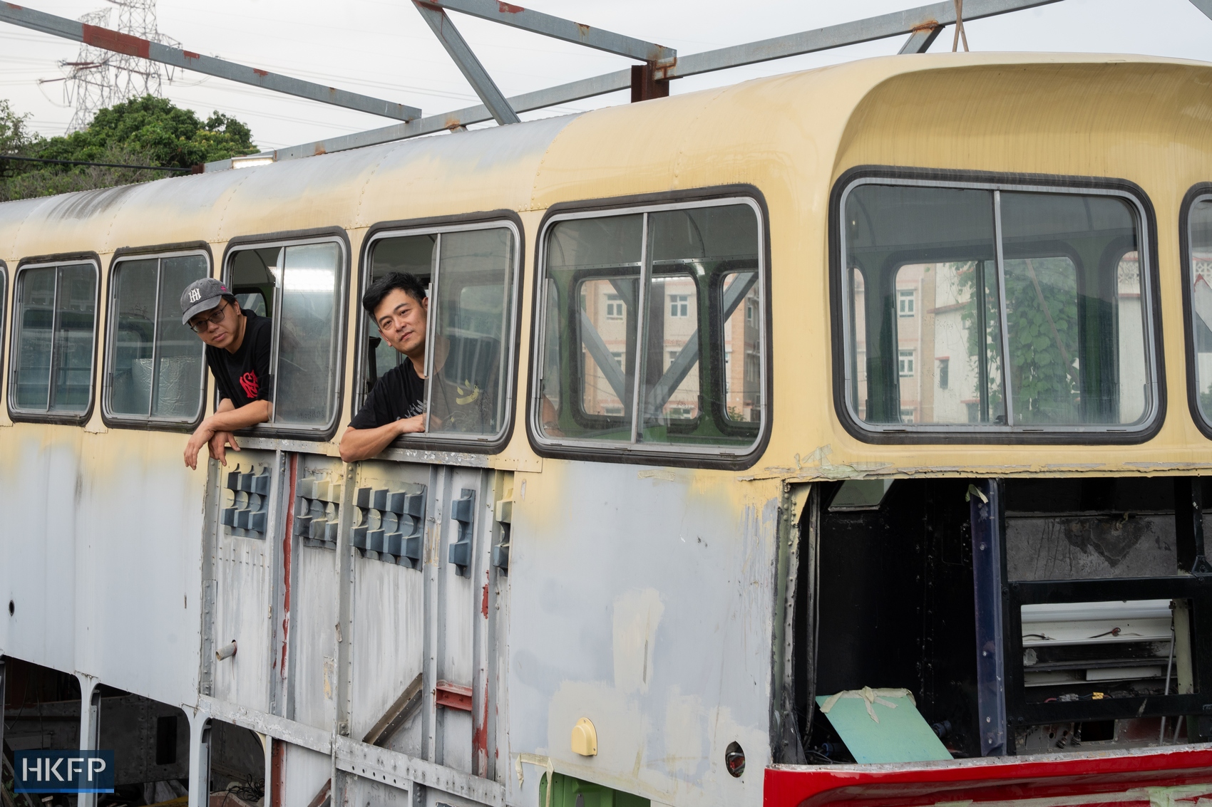 Chung (left) and Terrence with their Leyland Victory Mark II bus, which is undergoing restoration. Photo: Kyle Lam/HKFP.