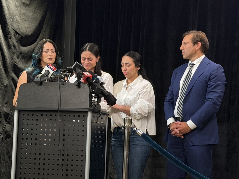 Johan SebastiΓ‘n DurΓ‘n Guerreroβs wife, Karolina Rojas Alvarez, spoke at a press conference on July 16, 2026. Her husband was killed by federal immigration agents July 13. She was joined by a translator, left, Guerreroβs sister, right, and attorney Benjamin Gideon. (Photo by Eesha Pendharkar/Maine Morning Star)