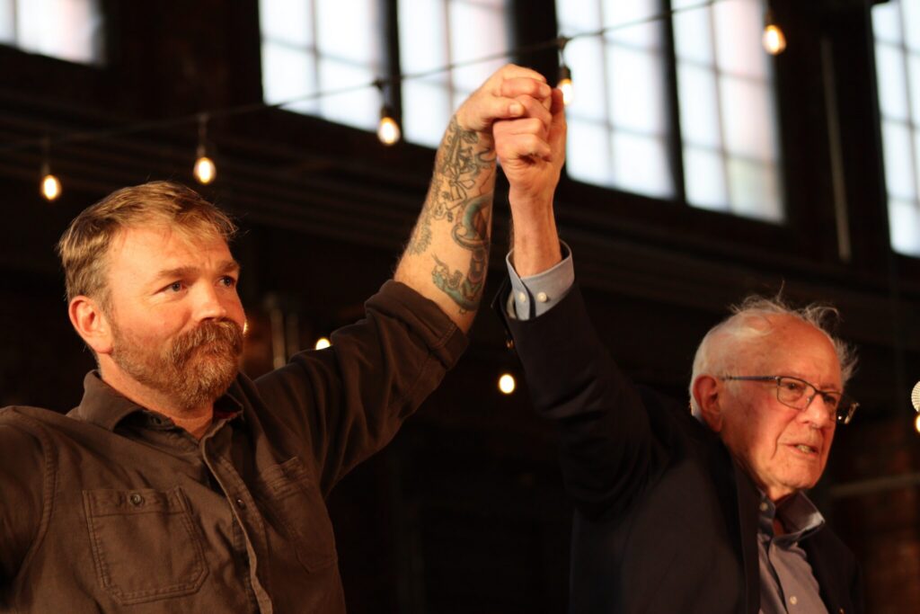 Independent U.S. Sen. Bernie Sanders of Vermont on Tuesday, July 7, 2026, said he told U.S. Senate candidate Graham Platner of Maine he should "step aside." In this photo, Sanders, right, rallies with Platner in Portland on May 25, 2026. (Photo by Emma Davis/ Maine Morning Star)