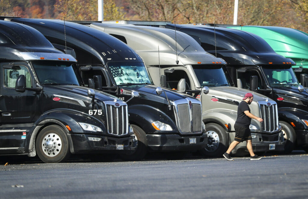Tractor trailers sit parked in a row at a truck stop in Bloomsbury, N.J. (Photo by Dana DiFilippo/New Jersey Monitor)