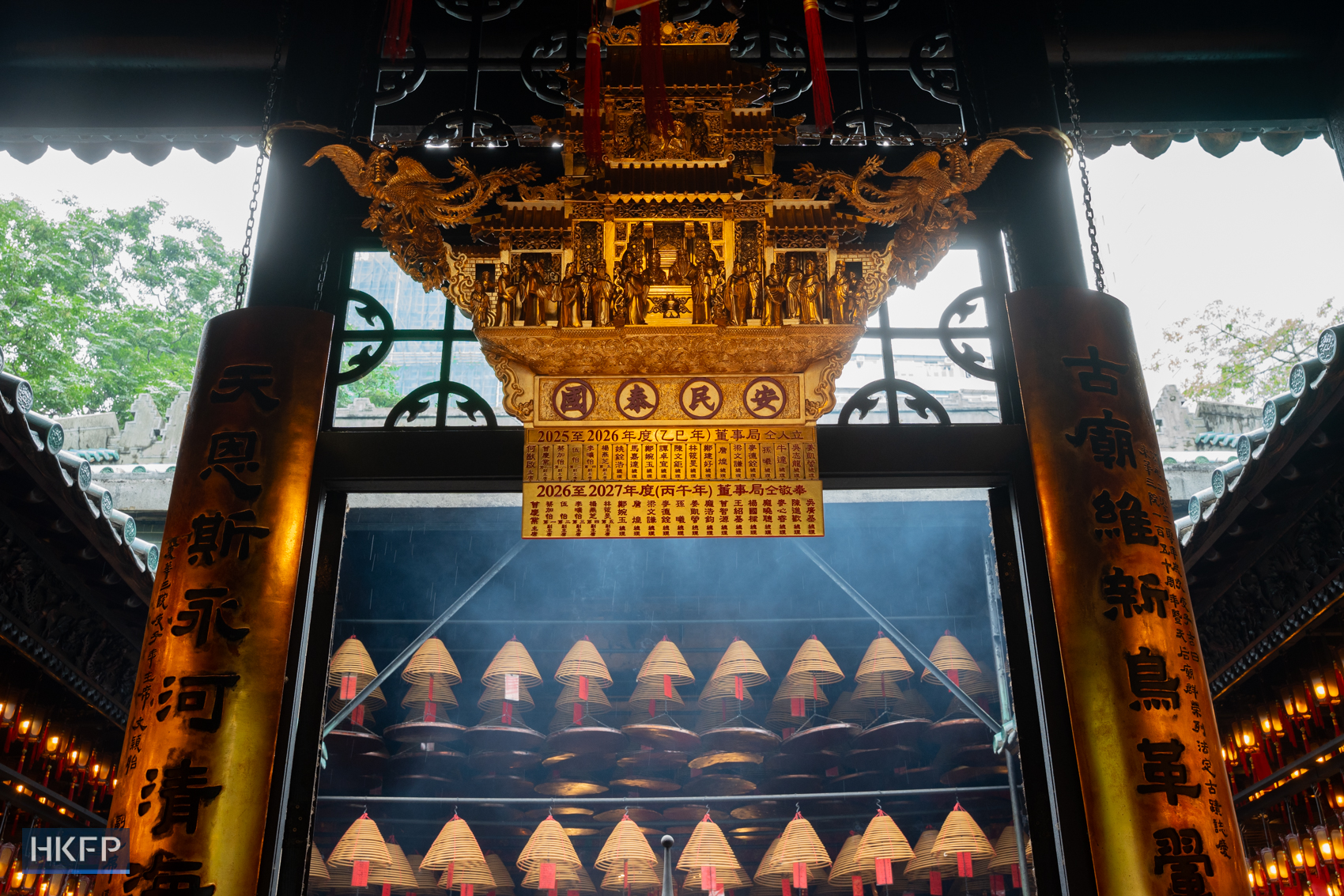 A gold painted wooden decoration, restored by Vitus Siu and Sylverster Siu, hangs in a temple in Yau Ma Tei, July 27th, 2026. Photo: Kyle Lam/HKFP.