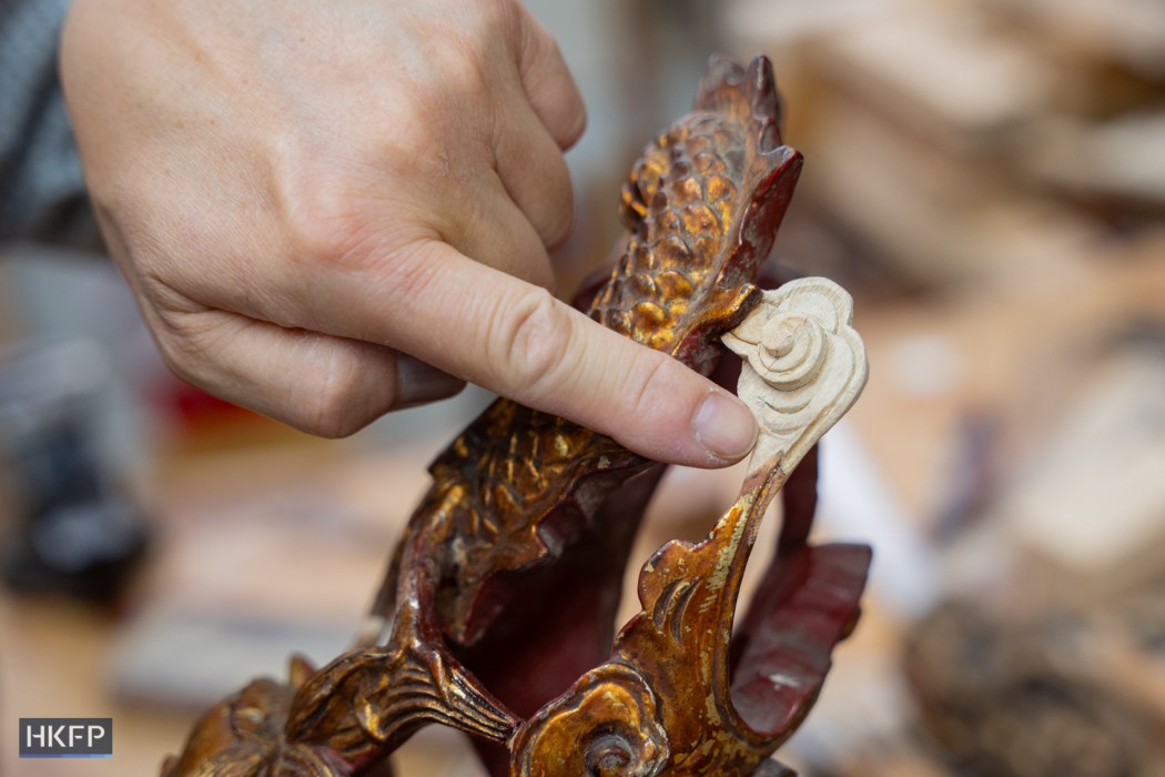 A historical candle holder decoration restored by Vitus Siu with new hand crafted wood piece. Photo: Kyle Lam/HKFP.