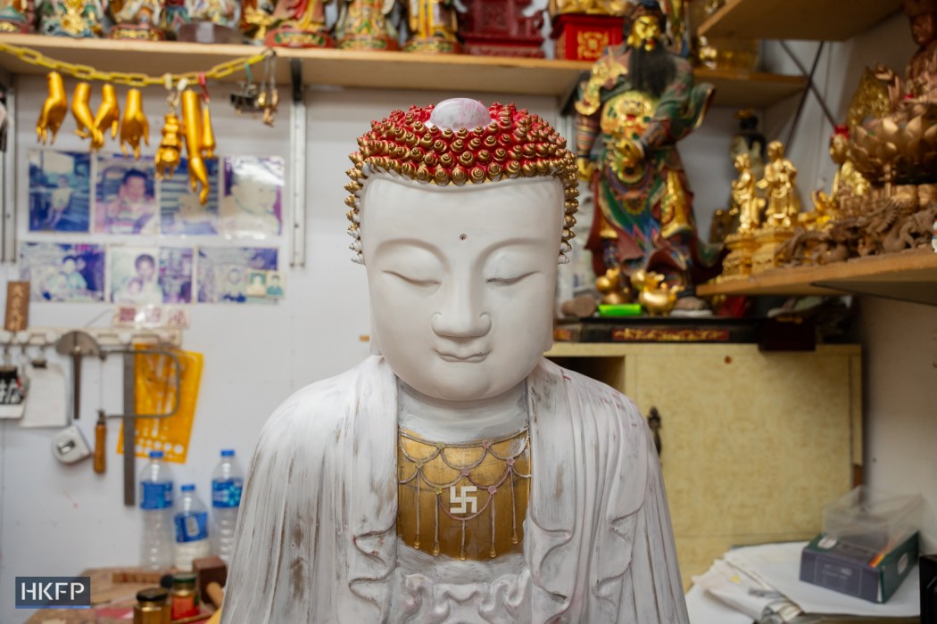 A buddha statue in an industrial building in Kwai Chung, July 27th, 2026. Photo: Kyle Lam/HKFP.