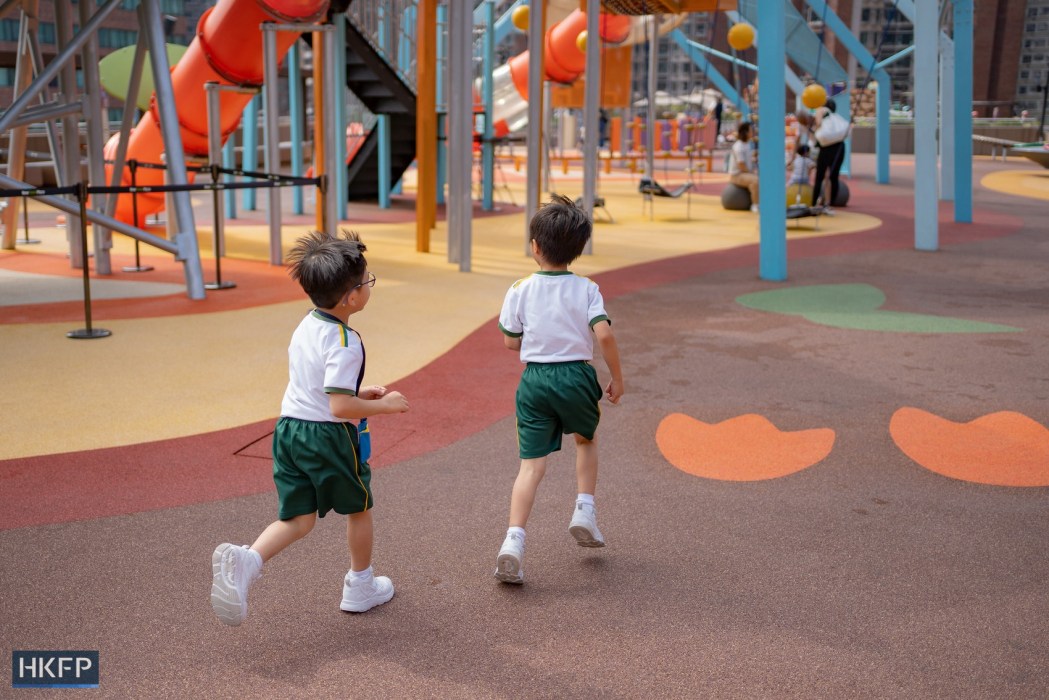 Children running around in a playground in Hong Kong. Photo: Kyle Lam/HKFP.
