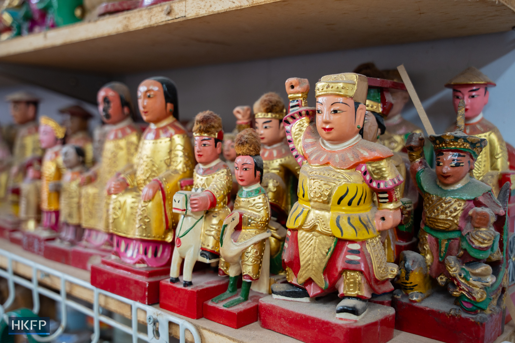 Wooden statues displayed in an industrial building in Kwai Chung area, June 12th, 2026. Photo: Kyle Lam/HKFP.