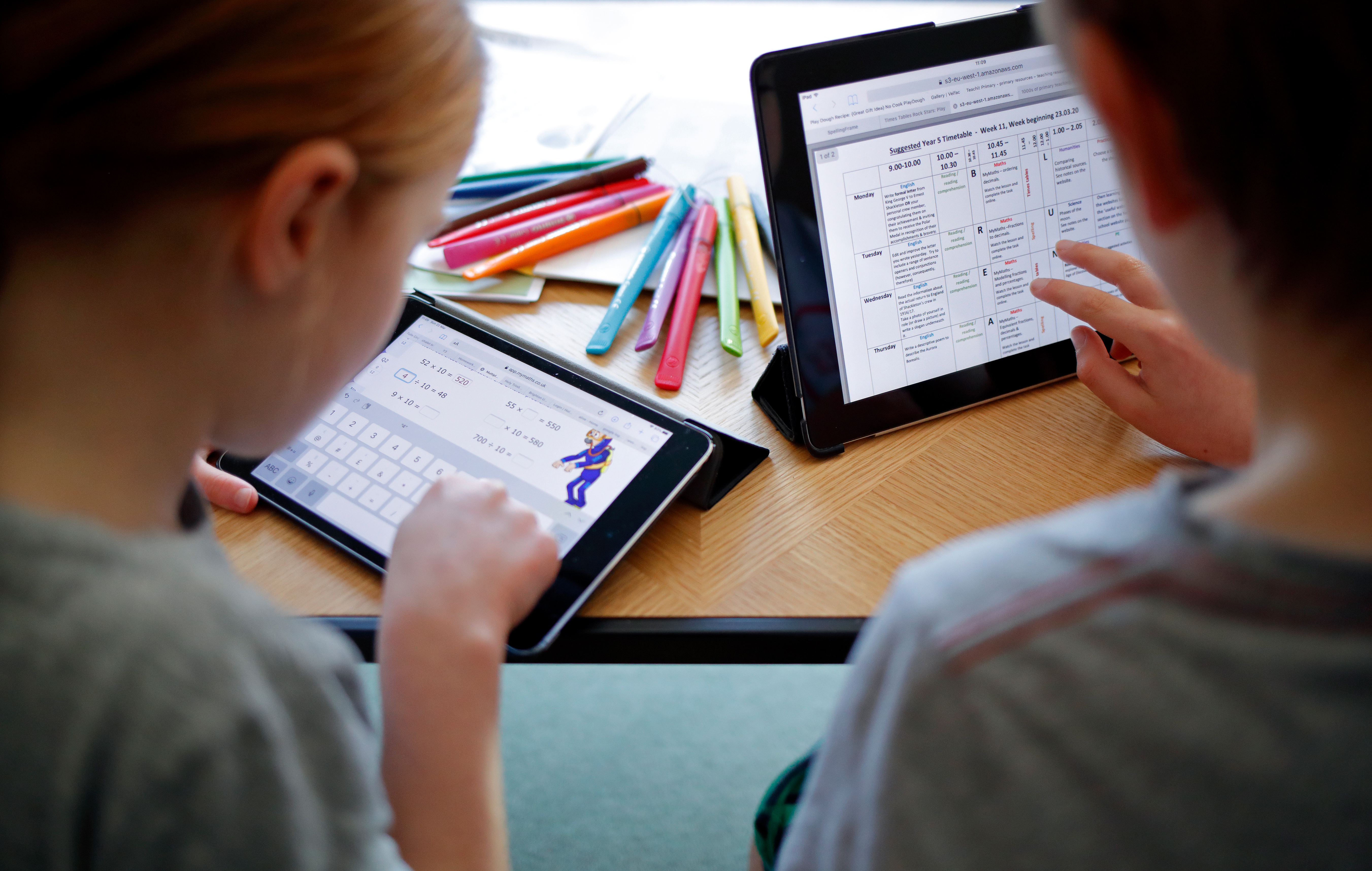 Kids look at screens.