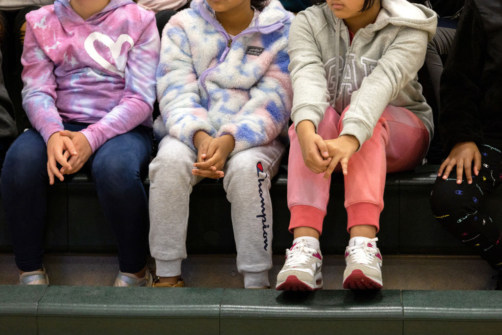 Eighth-grade students listen to a lecture on internet safety and cyberbullying at a middle school assembly in Connecticut in 2022. Experts studying the rise in pediatric suicide point to many stressors for preteens, including COVID-19 fallout, social media use, lack of sleep, bullying both online and in person, and policies restricting gender-affirming care for trans kids that have created fear for some LGBTQ+ youth. (Photo by John Moore/Getty Images)