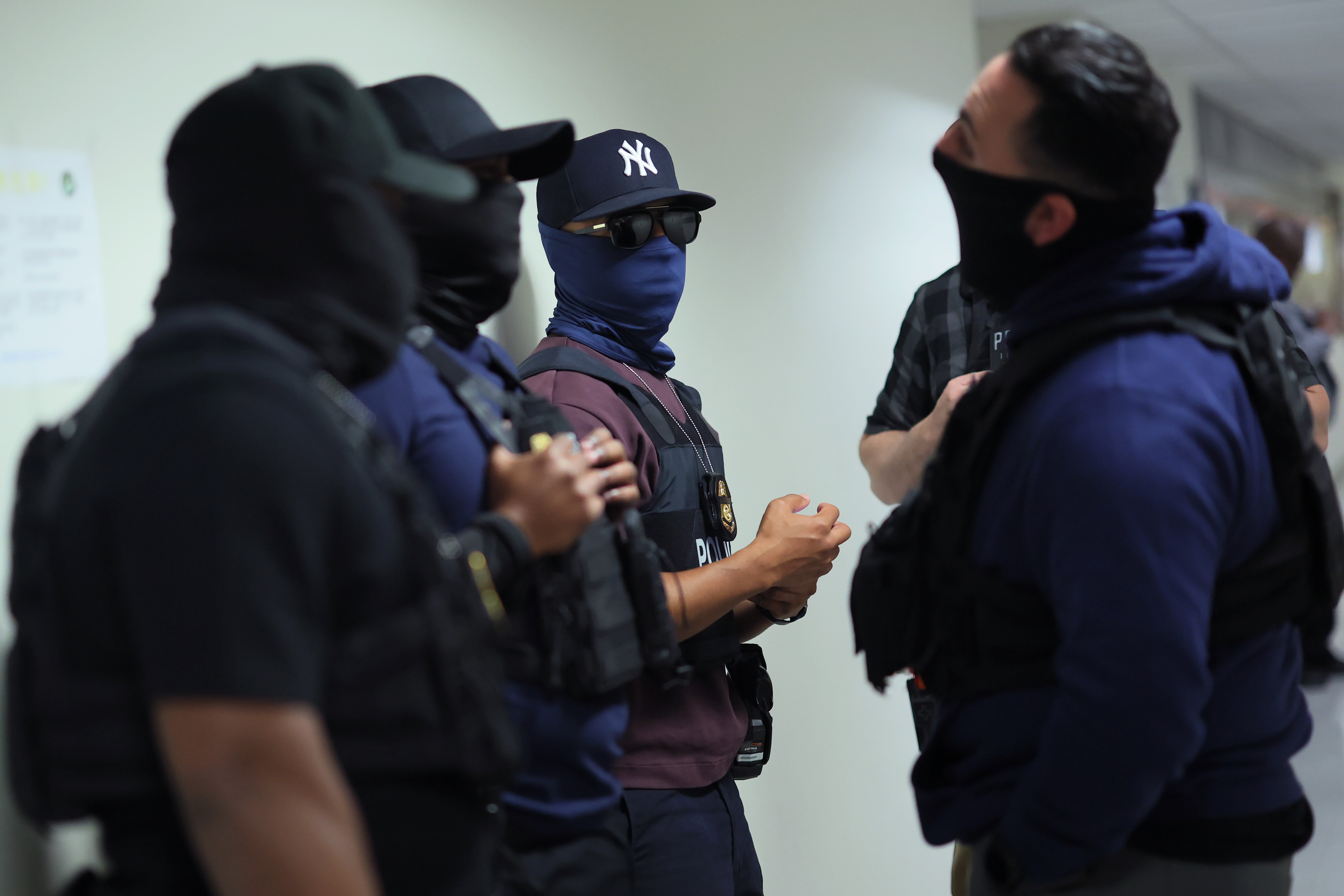 Federal agents patrol the halls of immigration court at the Jacob K. Javits Federal Building in November 2025 in New York City.