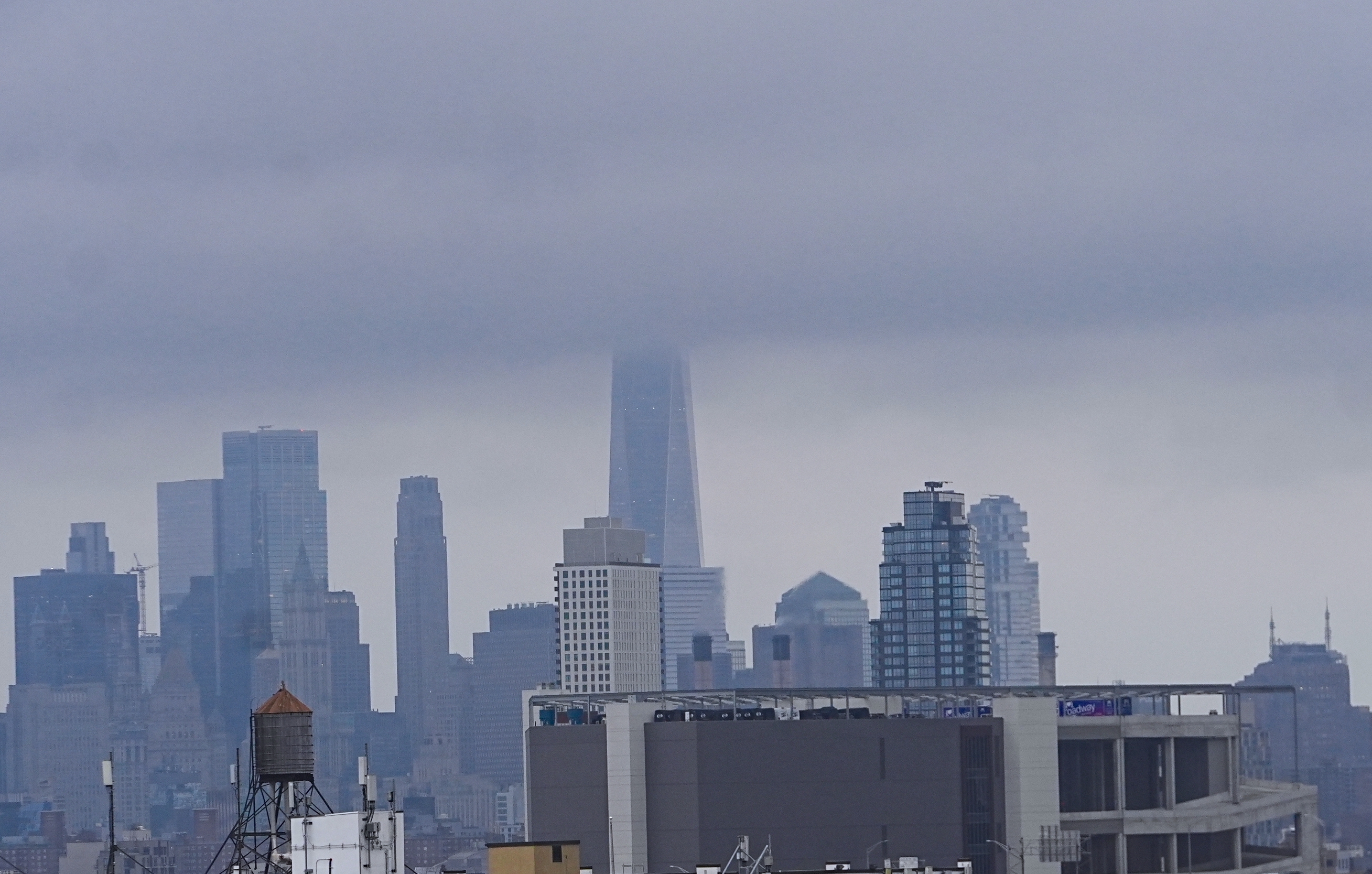 A view of Manhattan from Queens on a rainy and cloudy day.