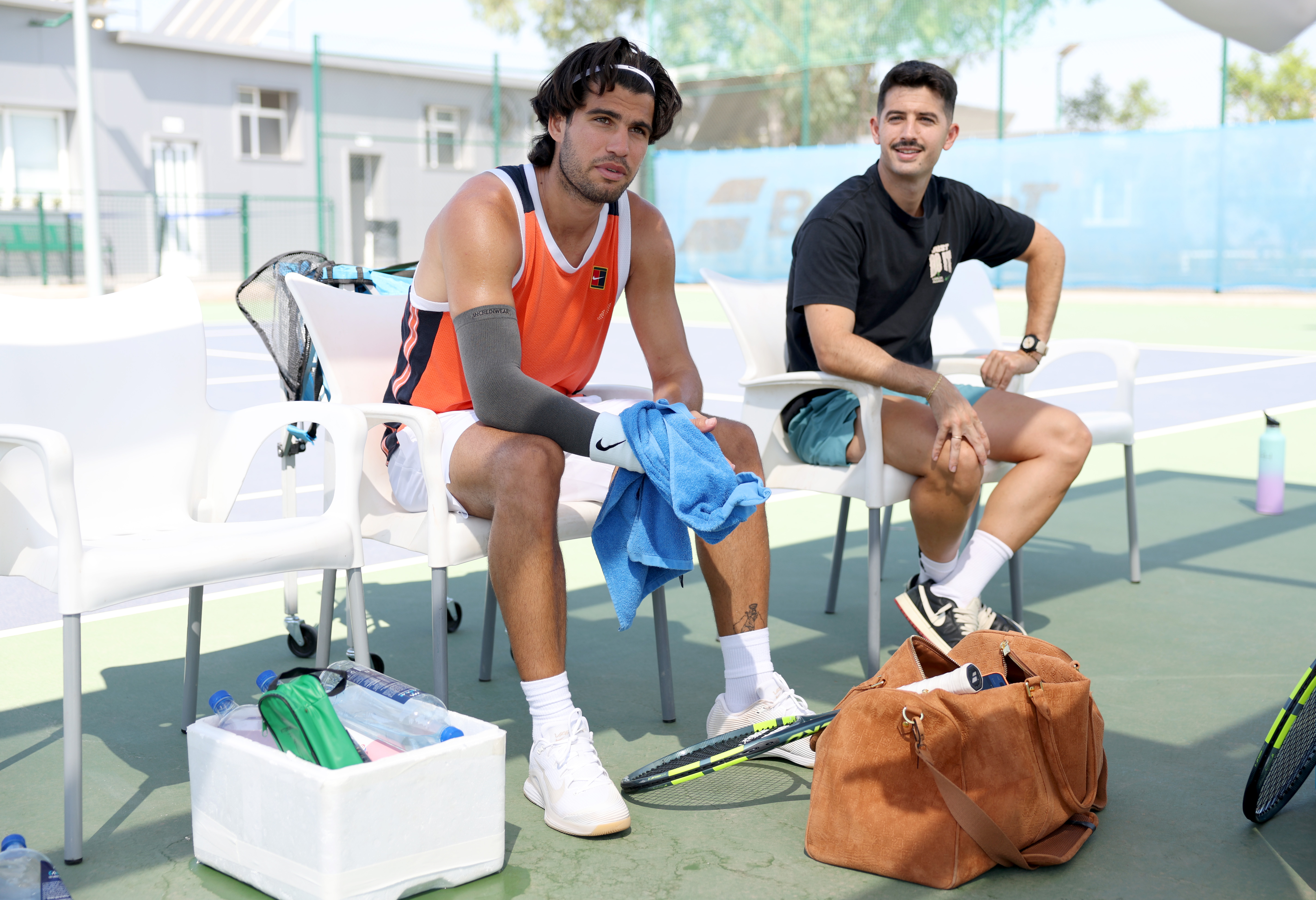 Carlos Alcaraz of Spain with his his physio Fran Rubio after his last practice session before travelling to New York for the US Open.