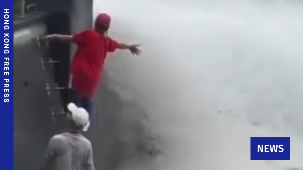 A pair of hikers enter Ho Pui Reservoir's spillway for photo. Photo: Screenshot, via Threads.