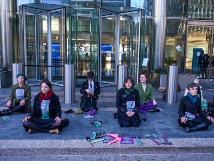 Extinction Rebellion activists outside Barclays HQ in Canary Wharf, 2021