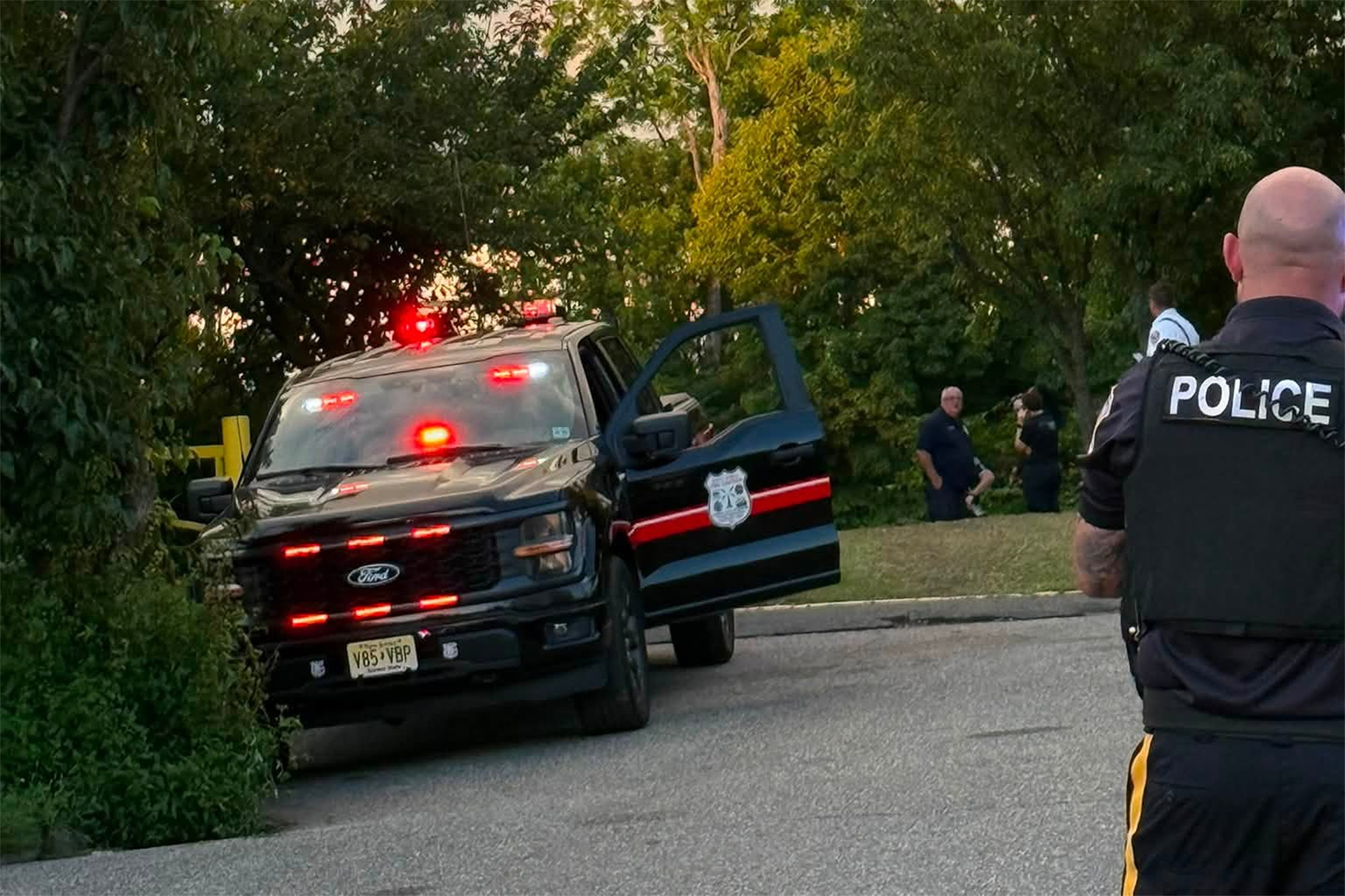 Emergency vehicles outside of the Passaic River